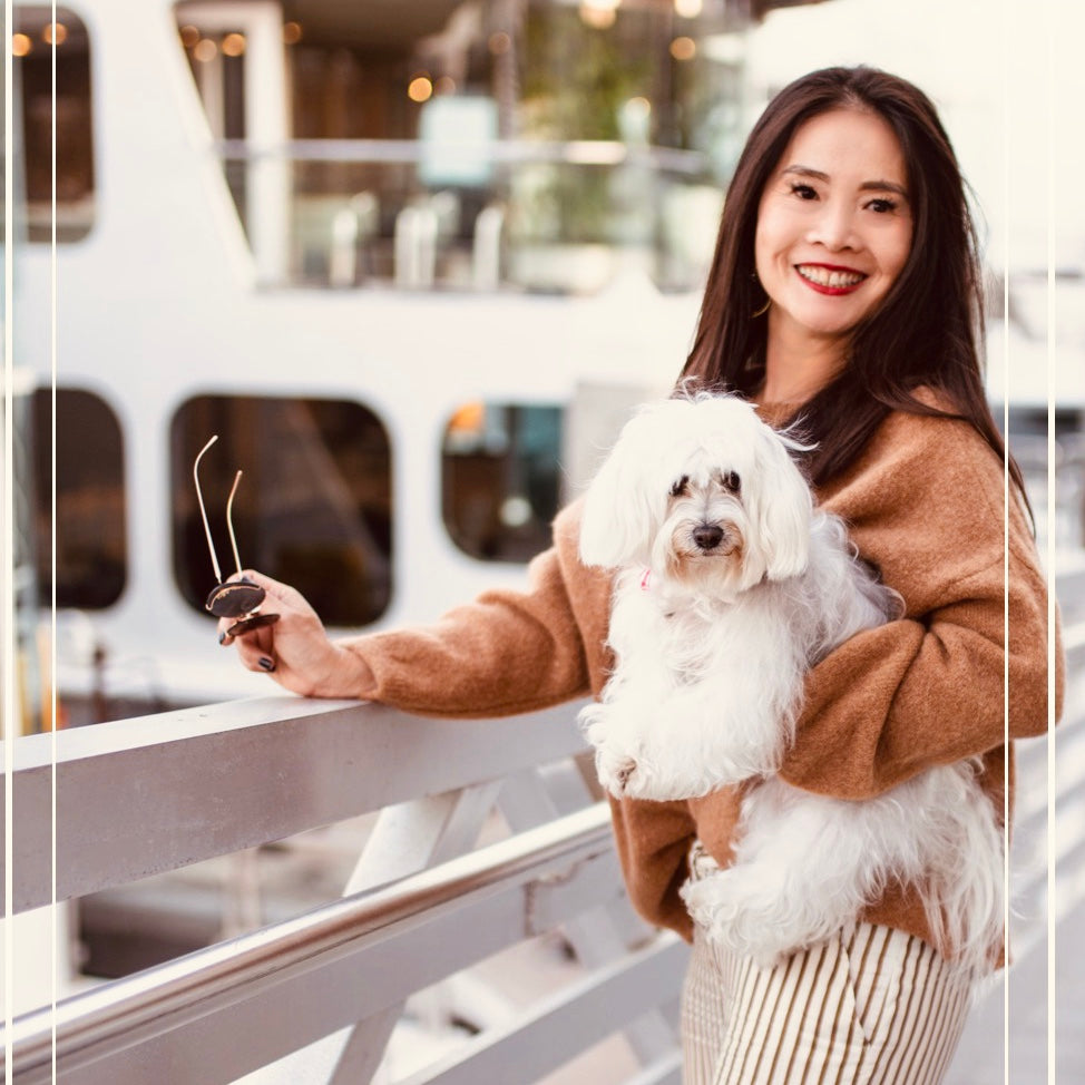 Girl holding dog