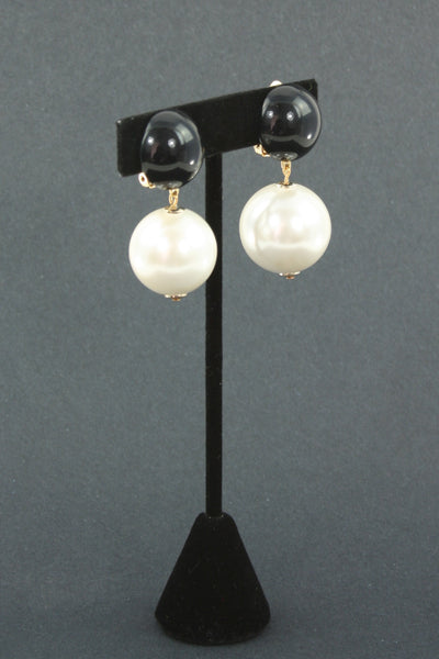 black and single pearl clip earring side view